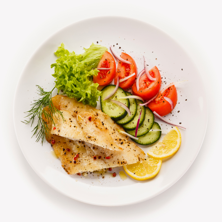 Wedding Dish On White Plate Consisting Of Chicken Breast And Vegetables